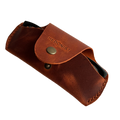Small Soft Leather Eye Glasses Case in Cognac, angled view with folded sunglasses peeking out
