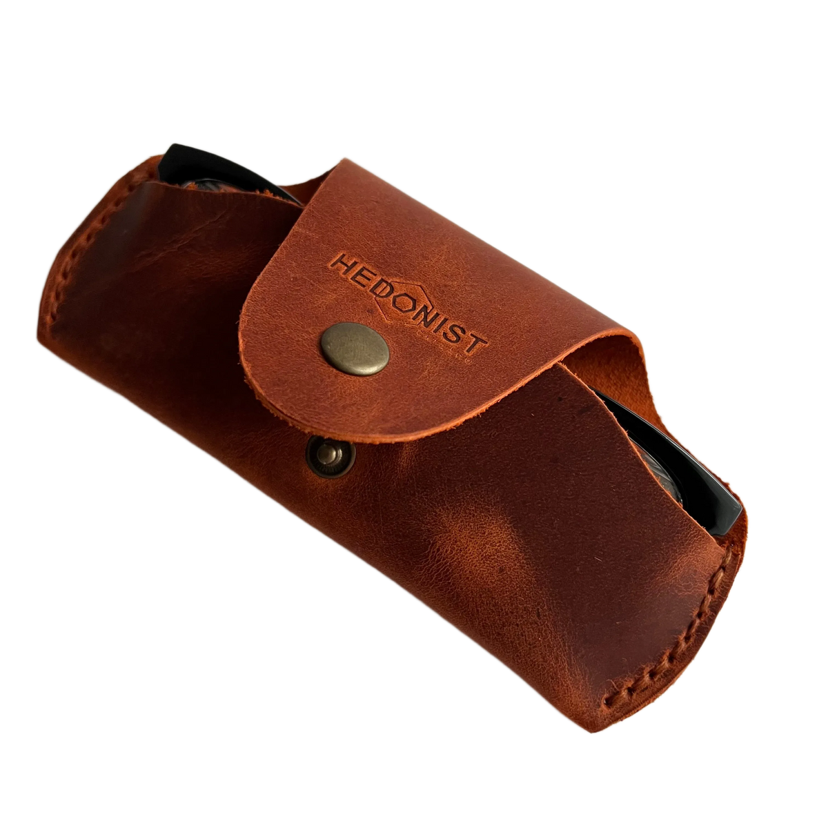 Small Soft Leather Eye Glasses Case in Cognac, angled view with folded sunglasses peeking out