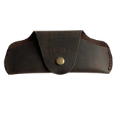 Small Soft Leather Eye Glasses Case in Dark Brown, closed, front view with embossed Hedonist logo and snap closure