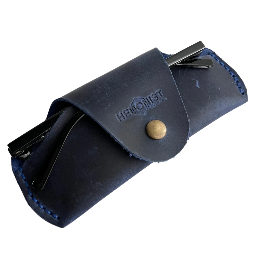 Small Soft Leather Eye Glasses Case in Navy Blue, angled view with sunglasses temples visible poking out