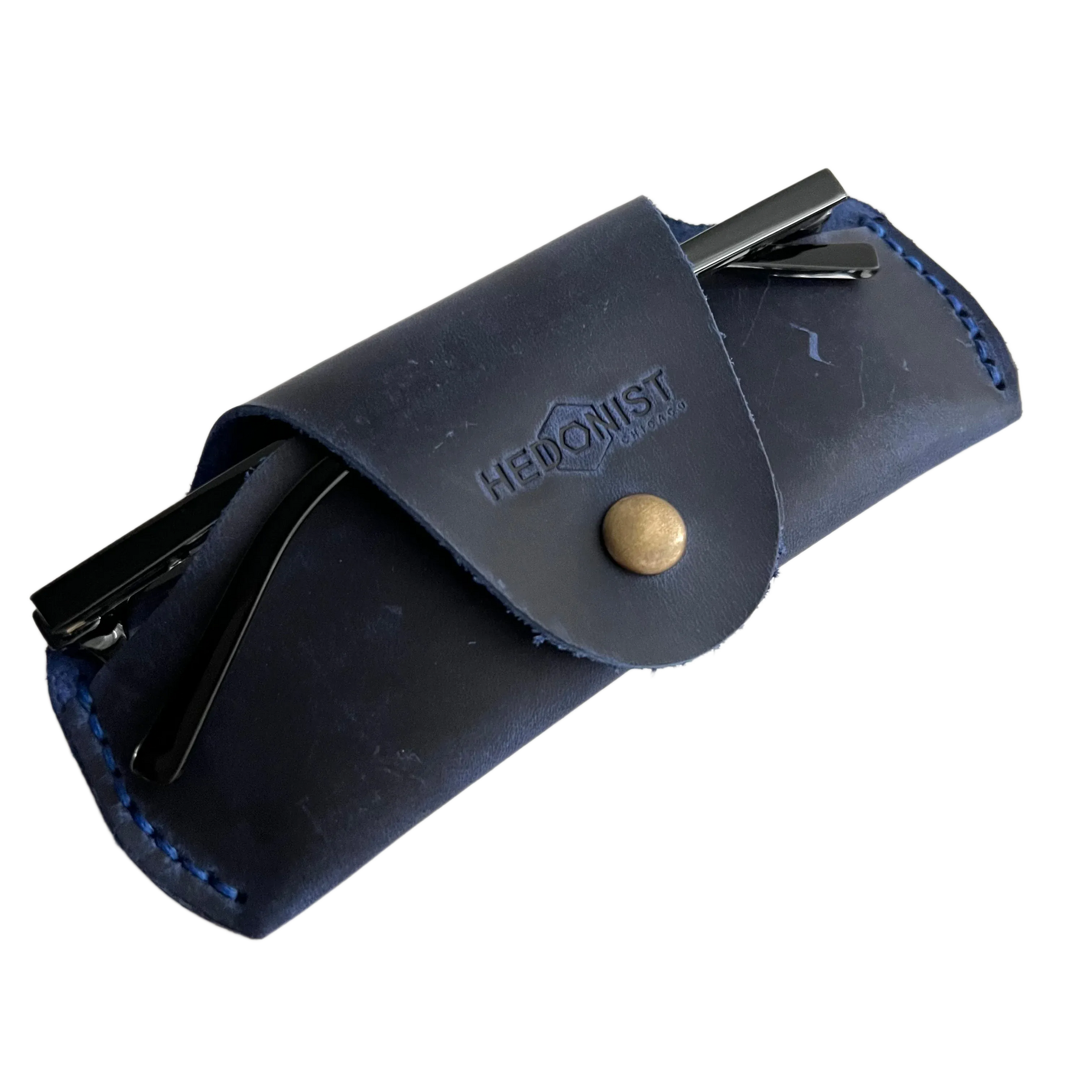Small Soft Leather Eye Glasses Case in Navy Blue, angled view with sunglasses temples visible poking out