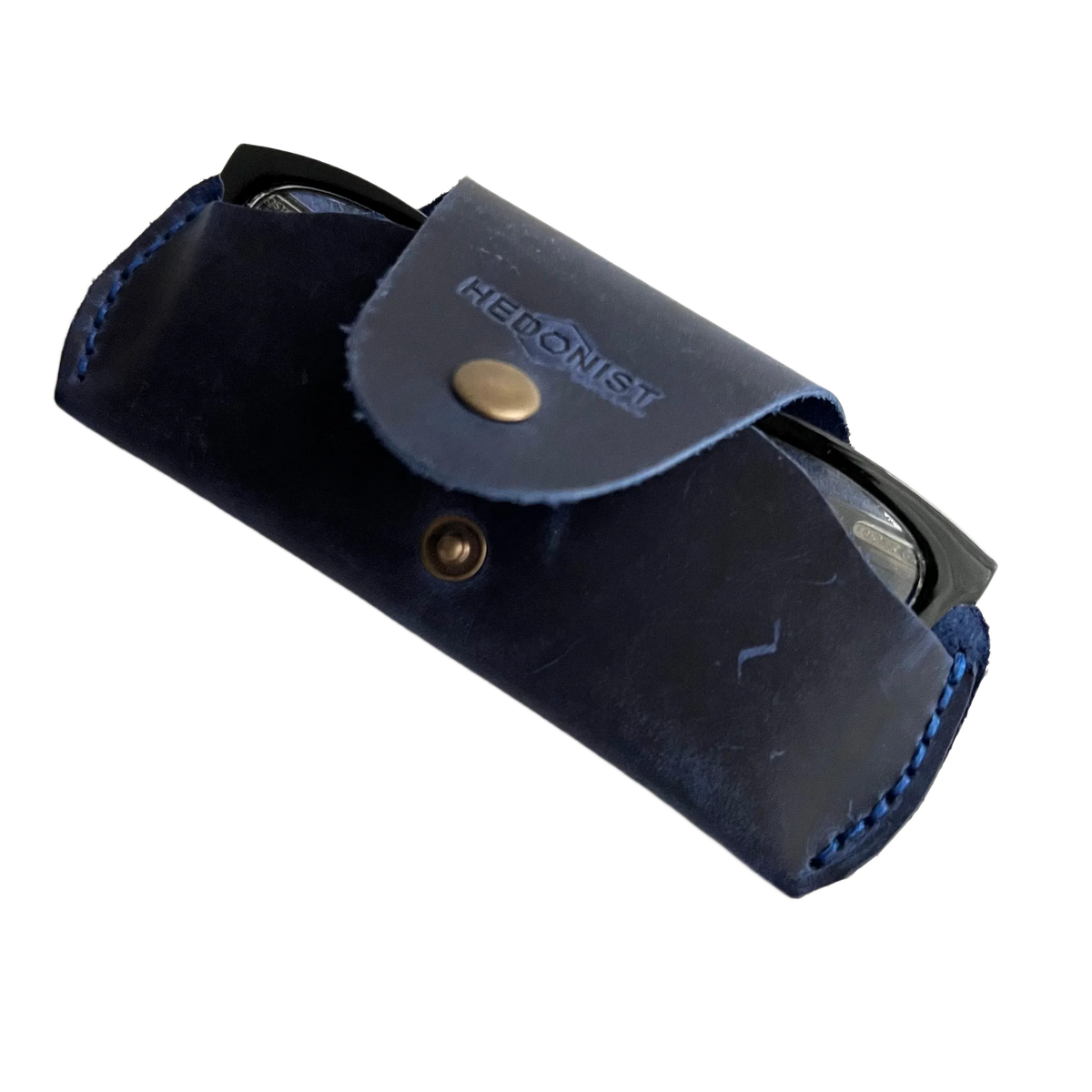 Small Soft Leather Eye Glasses Case in Navy Blue, angled view with black-framed eyeglasses tucked inside