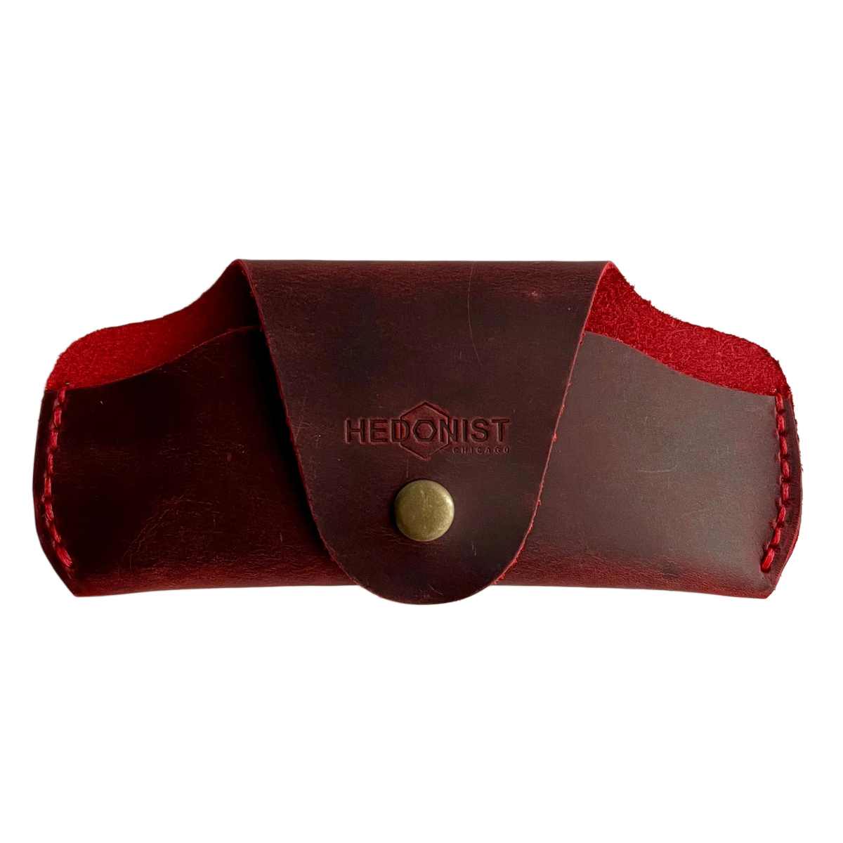 Small Soft Leather Eye Glasses Case in Red, closed, front view with embossed Hedonist logo and snap closure