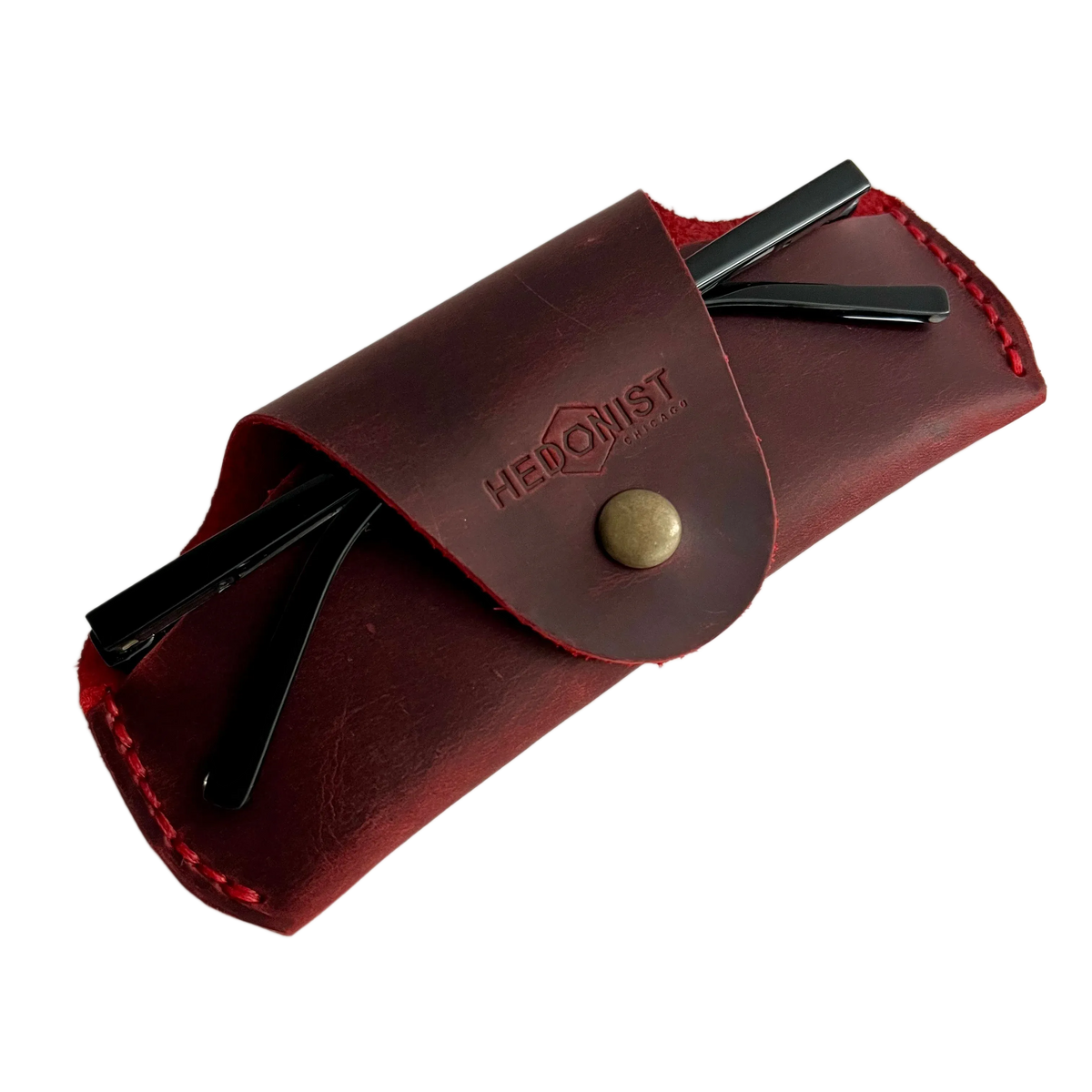 Small Soft Leather Eye Glasses Case in Red, angled view with sunglasses temples visible poking out