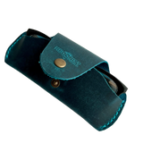 Small Soft Leather Eye Glasses Case in Teal, angled view with black-framed eyeglasses tucked inside