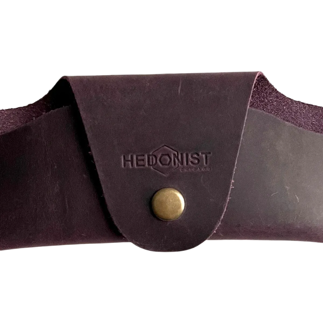 Small Soft Leather Eye Glasses Case in Plum, closed, front view with embossed Hedonist logo and snap closure