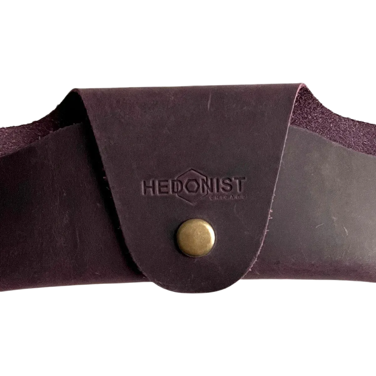Small Soft Leather Eye Glasses Case in Plum, closed, front view with embossed Hedonist logo and snap closure
