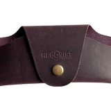 Small Soft Leather Eye Glasses Case in Plum, closed, front view with embossed Hedonist logo and snap closure