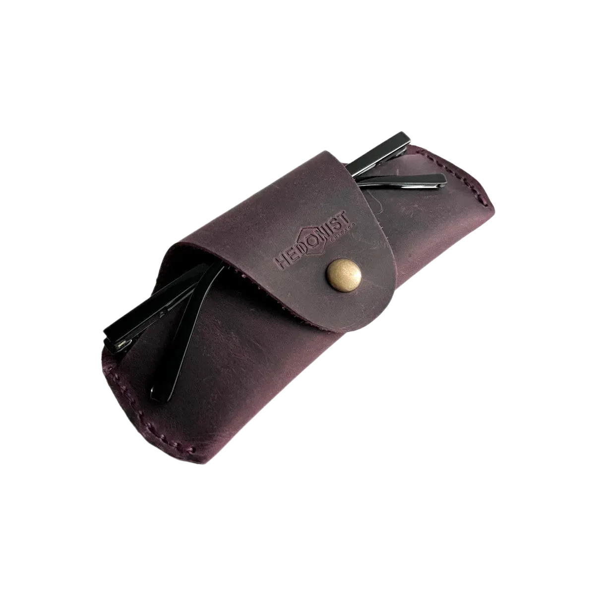 Small Soft Leather Eye Glasses Case in Plum, angled view with sunglasses temples visible poking out both sides