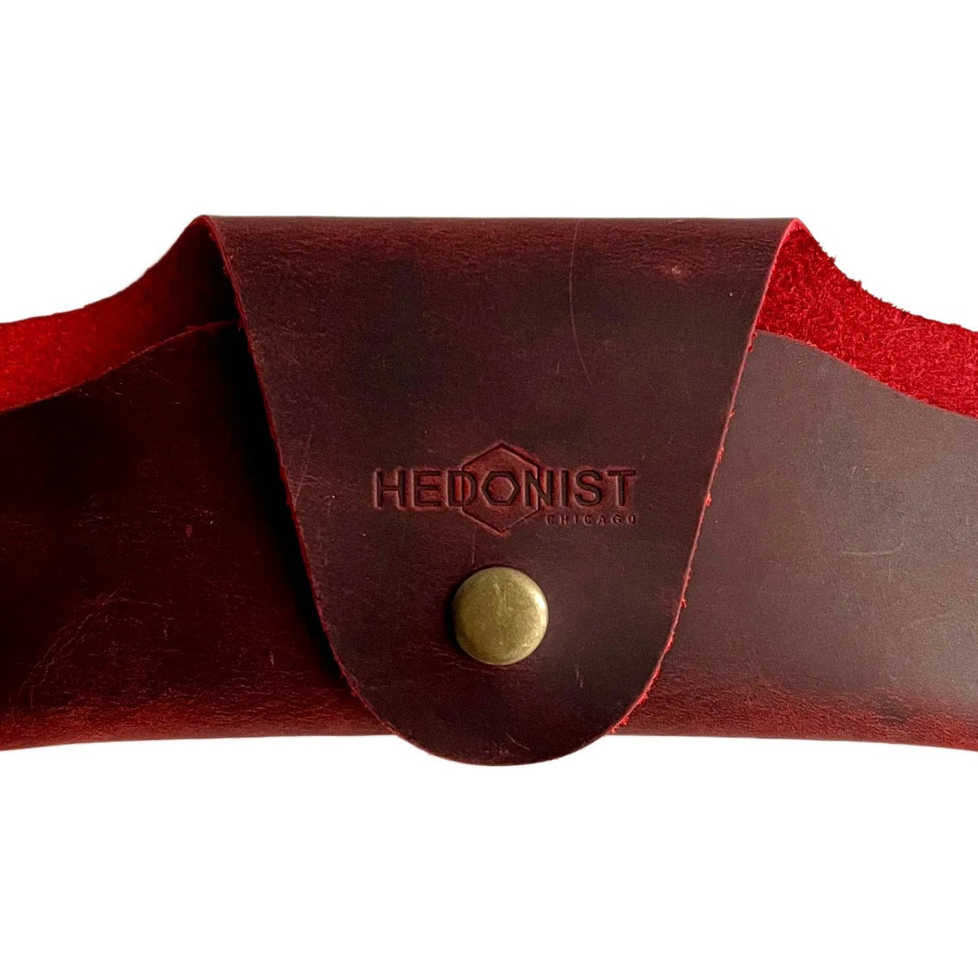 Small Soft Leather Eye Glasses Case in Red, closed, front view with embossed Hedonist logo and snap closure