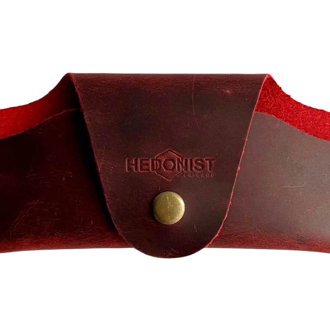 Small Soft Leather Eye Glasses Case in Red, closed, front view with embossed Hedonist logo and snap closure