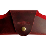 Small Soft Leather Eye Glasses Case in Red, closed, front view with embossed Hedonist logo and snap closure