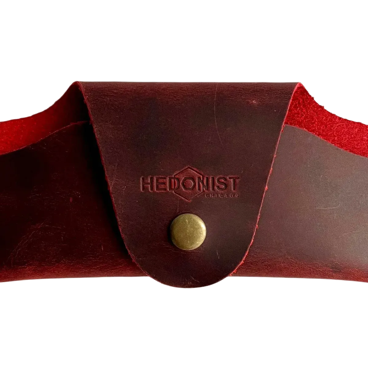 Small Soft Leather Eye Glasses Case in Red, closed, front view with embossed Hedonist logo and snap closure