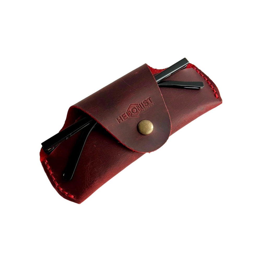 Small Soft Leather Eye Glasses Case in Red, angled view with sunglasses temples visible poking out