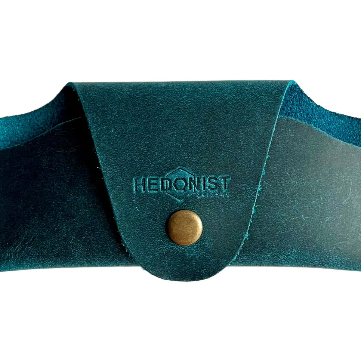 Small Soft Leather Eye Glasses Case in Teal, closed, front view with embossed Hedonist logo and snap closure