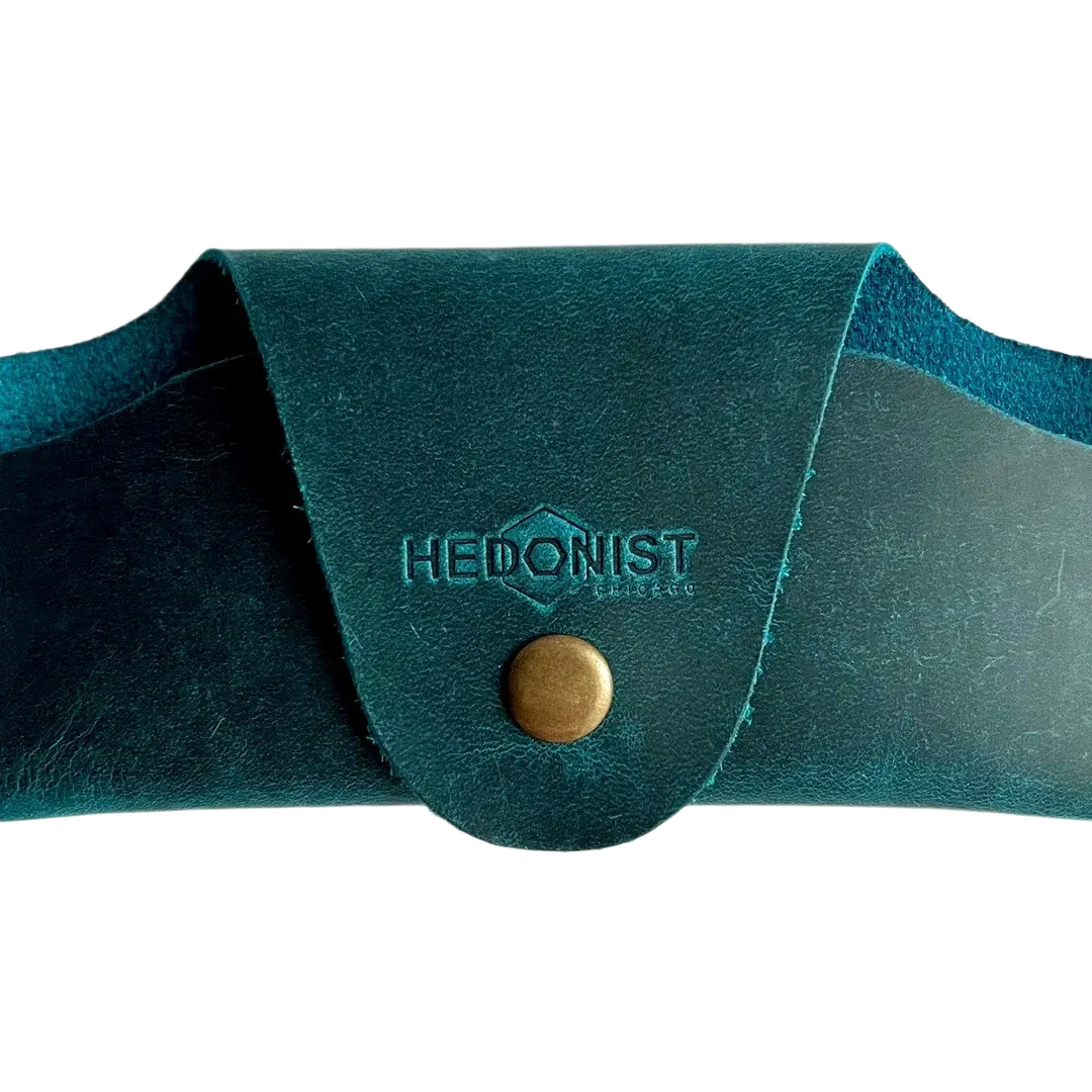 Small Soft Leather Eye Glasses Case in Teal, closed, front view with embossed Hedonist logo and snap closure