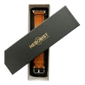 Tan padded leather Apple Watch band, presented in gift box