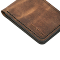 Handmade tan pull-up leather bifold wallet, interior card slots detail