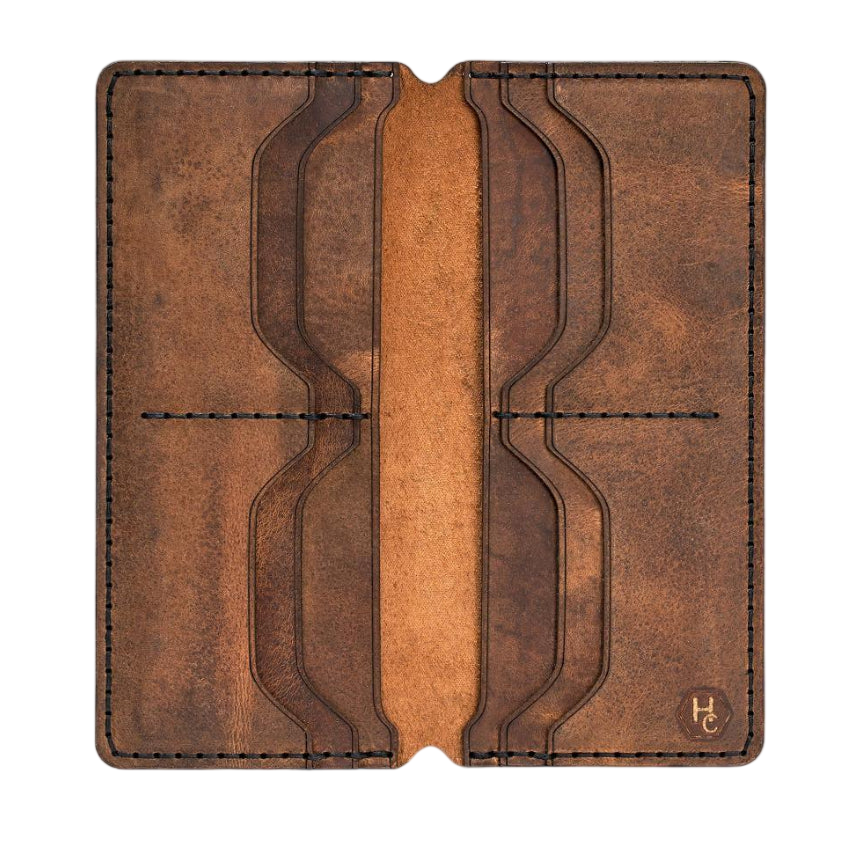 Handmade tan pull-up leather card holder, 8 card slots, open showing cards