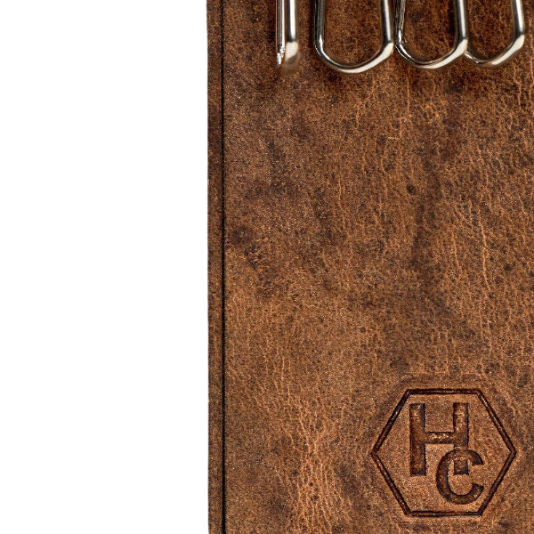 Hedonist Chicago tan key holder in tan, slim profile, full grain leather, flat lay view
