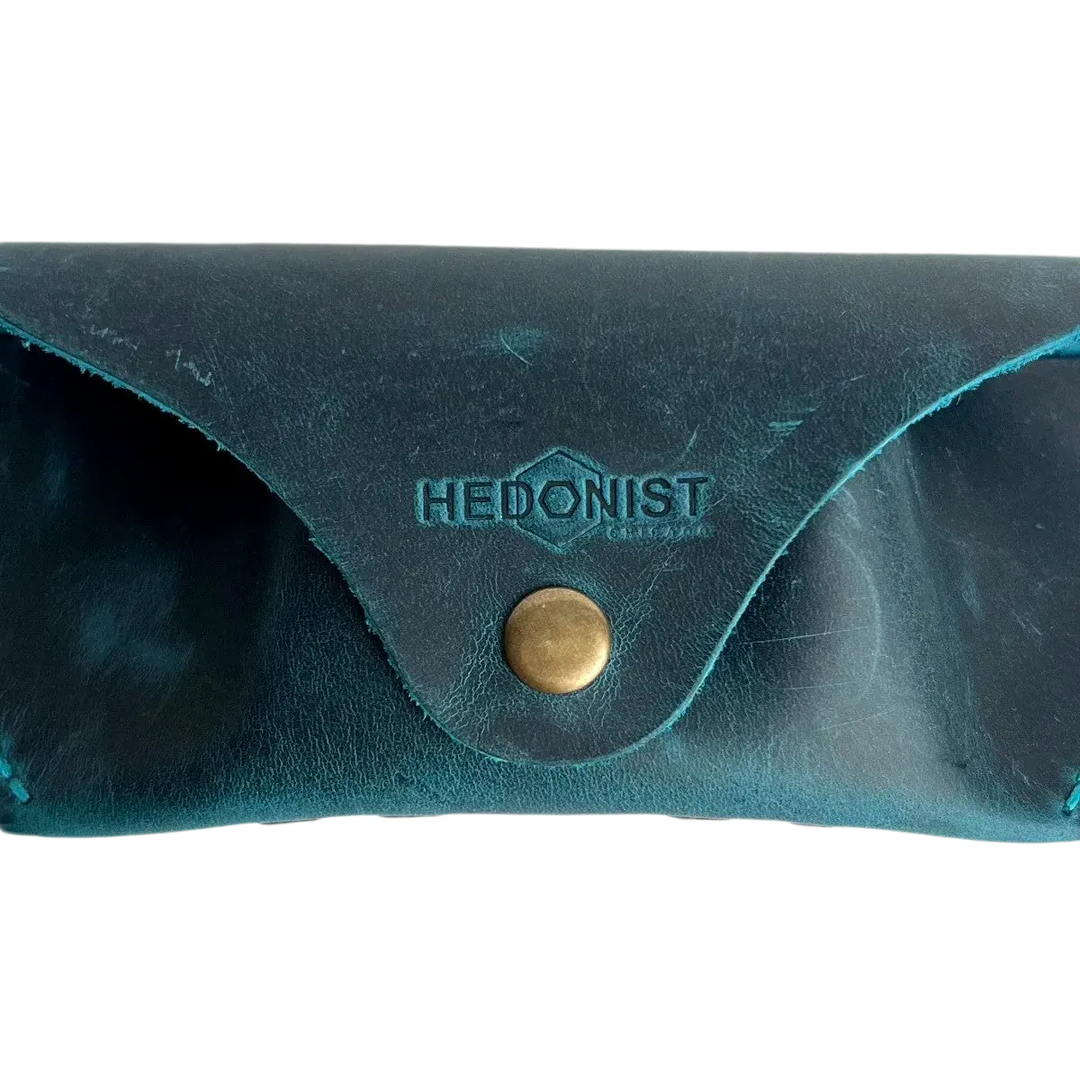 Soft Leather Eye Glasses Case in Teal, closed, front view with embossed Hedonist logo and snap closure