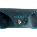 Soft Leather Eye Glasses Case in Teal, closed, front view with embossed Hedonist logo and snap closure