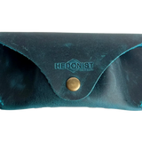 Soft Leather Eye Glasses Case in Teal, closed, front view with embossed Hedonist logo and snap closure