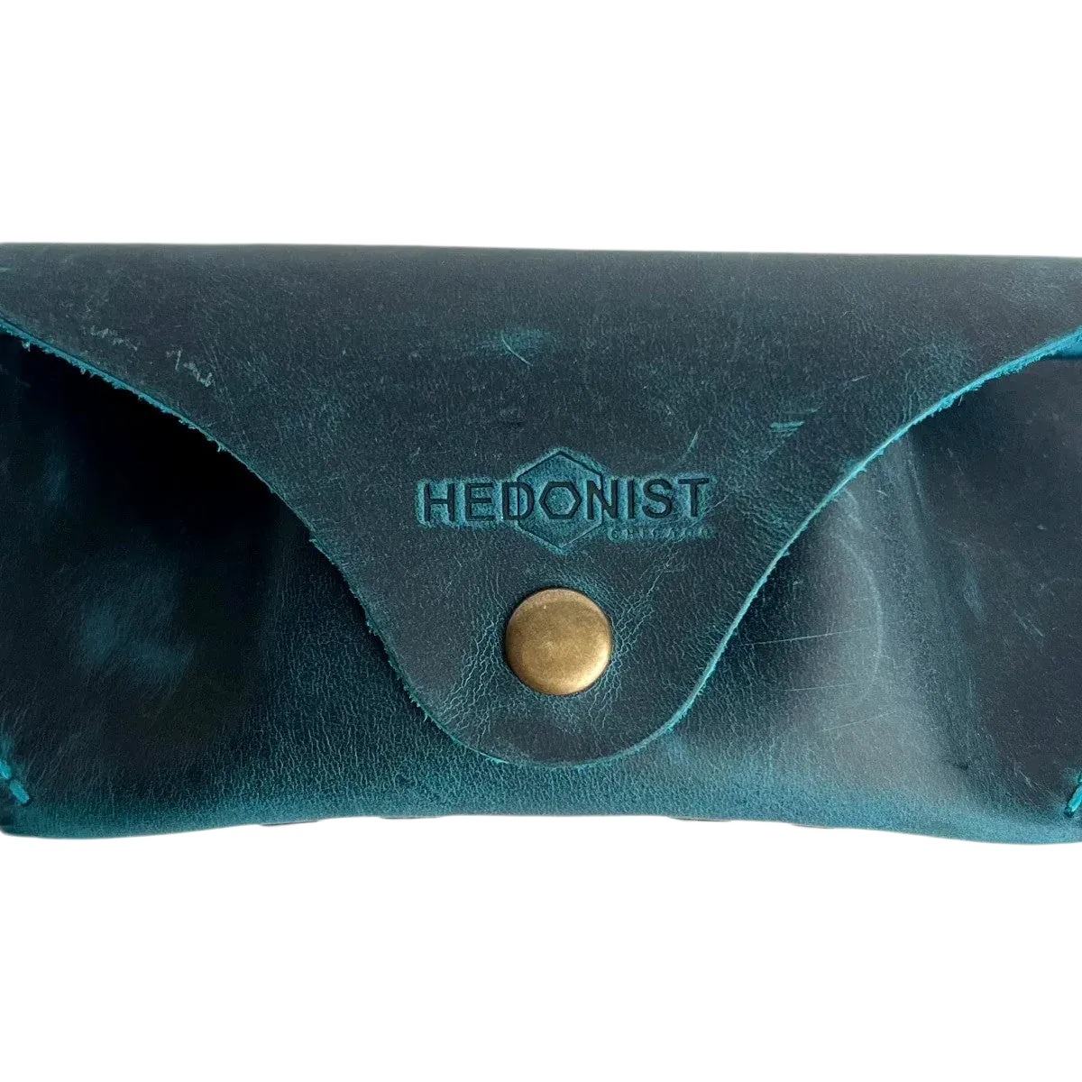 Soft Leather Eye Glasses Case in Teal, closed, front view with embossed Hedonist logo and snap closure