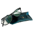Soft Leather Eye Glasses Case in Teal with black-framed eyeglasses resting on top