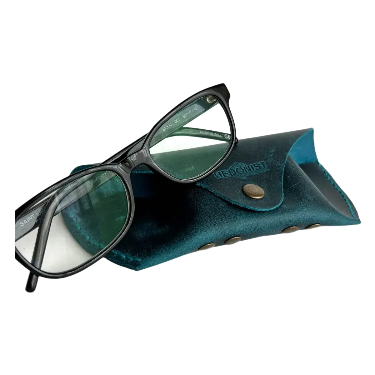 Soft Leather Eye Glasses Case in Teal with black-framed eyeglasses resting on top