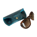 Soft Leather Eye Glasses Case in Teal with tortoiseshell sunglasses beside it