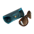 Soft Leather Eye Glasses Case in Teal with tortoiseshell sunglasses beside it