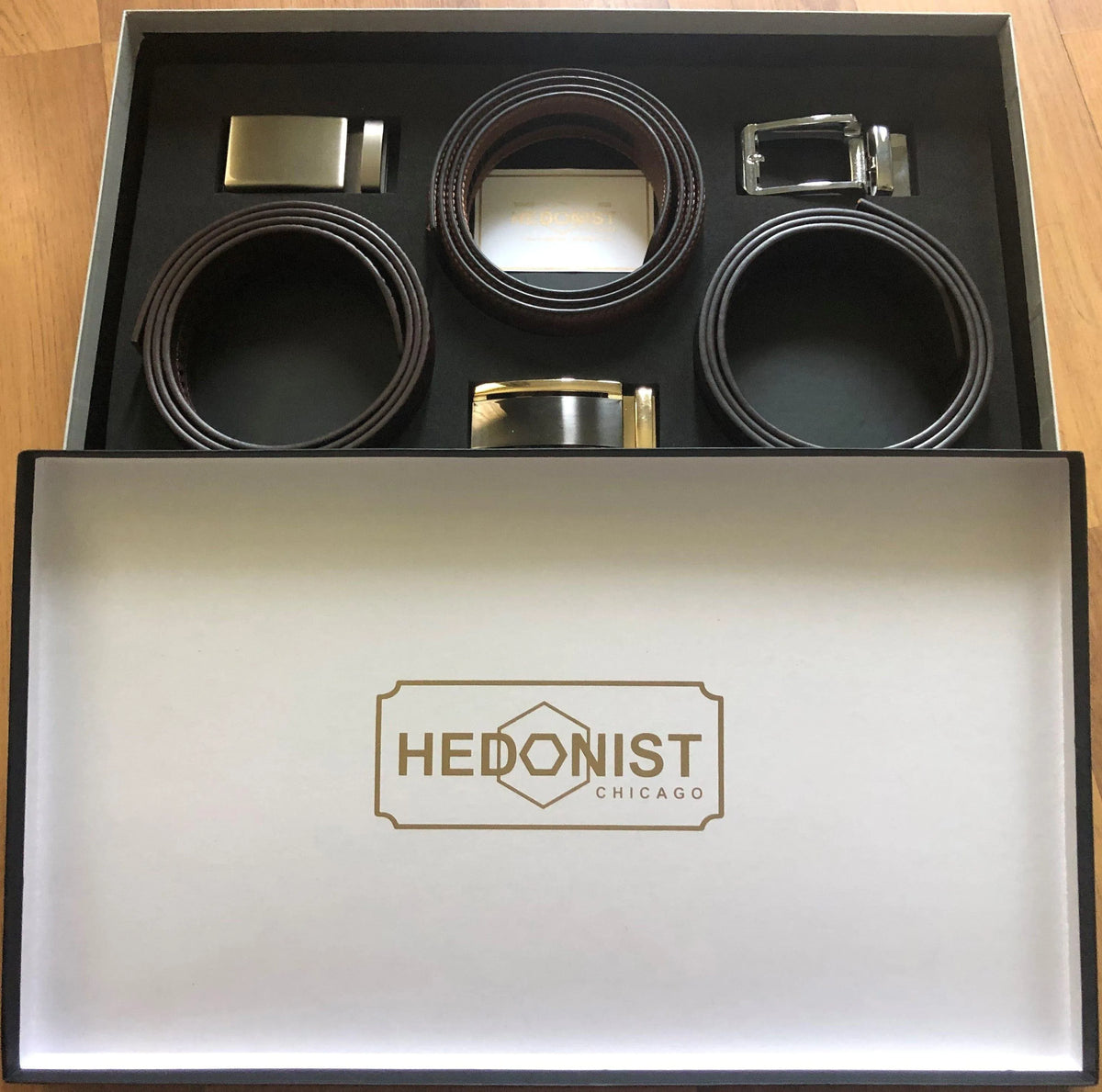 Three leather belts gift set displayed in branded box