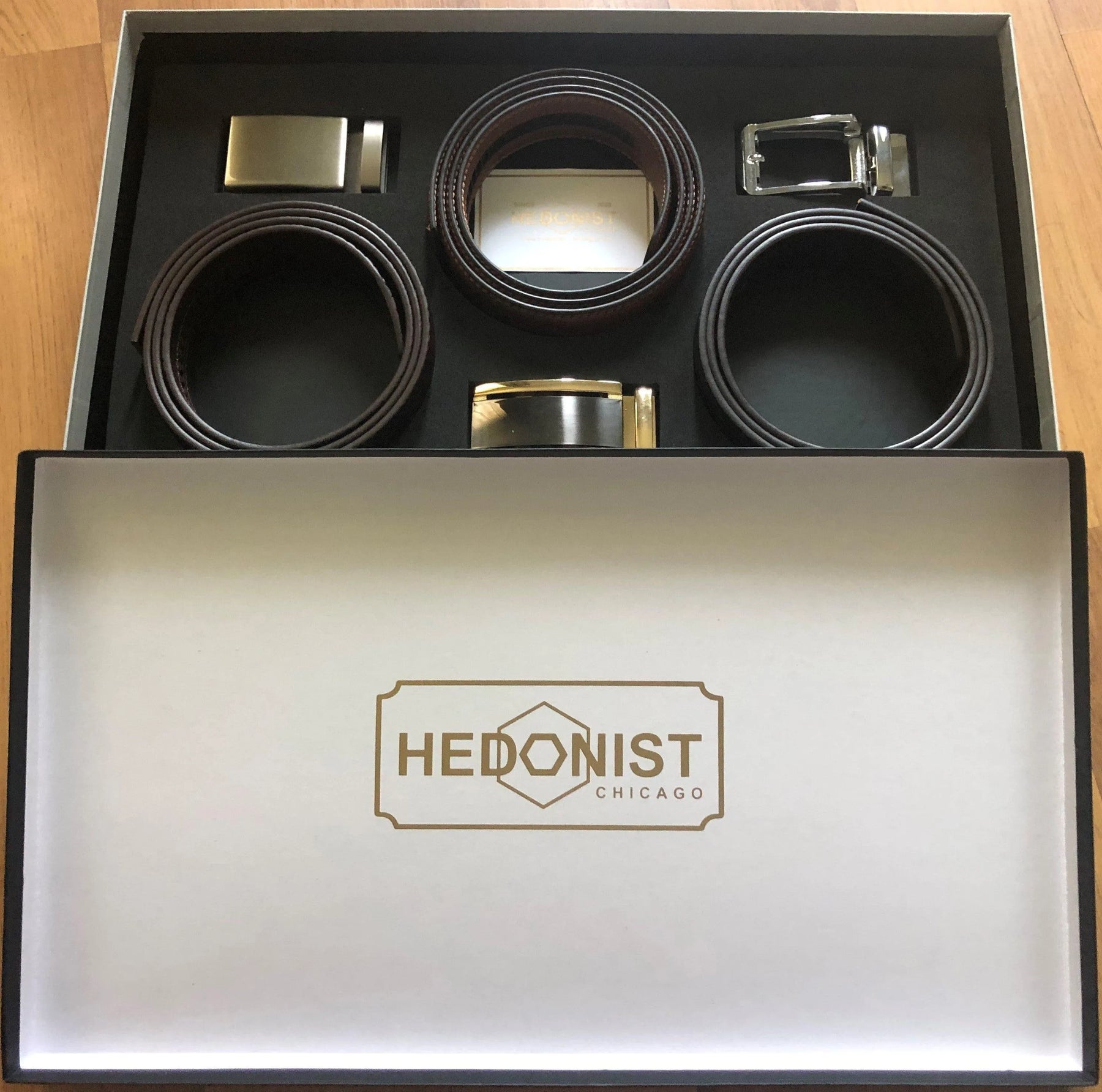 Three leather belts gift set displayed in branded box