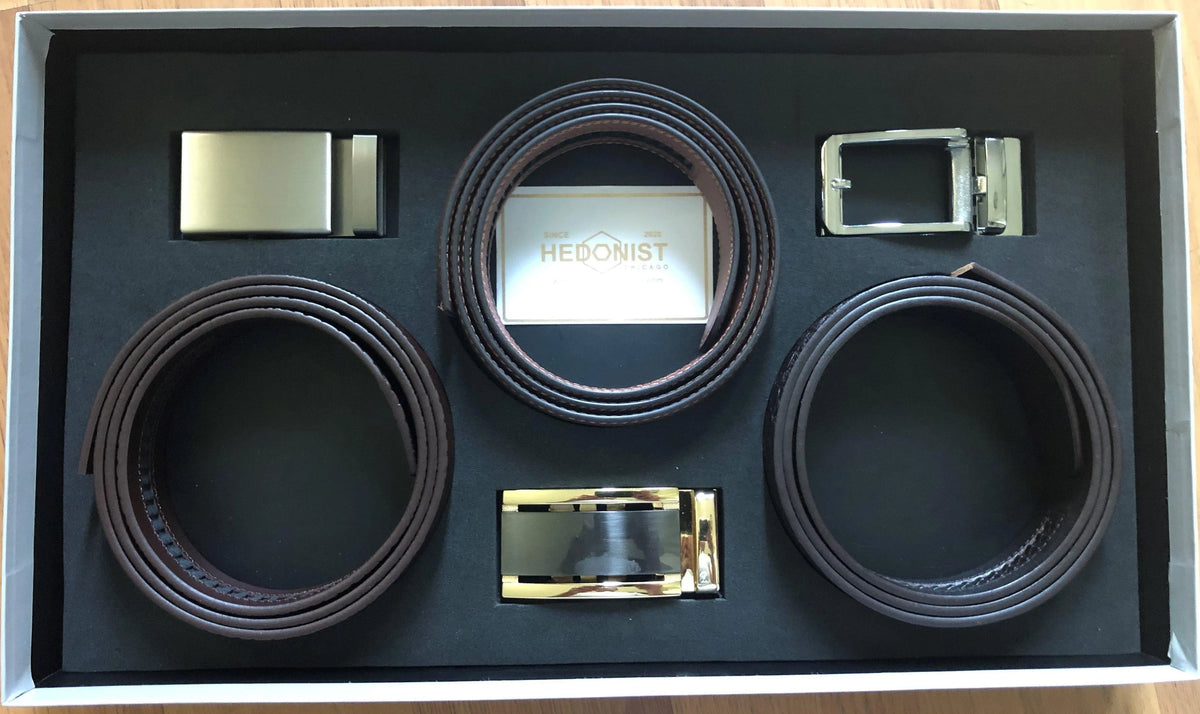 Three leather belts gift set, close-up view of box contents