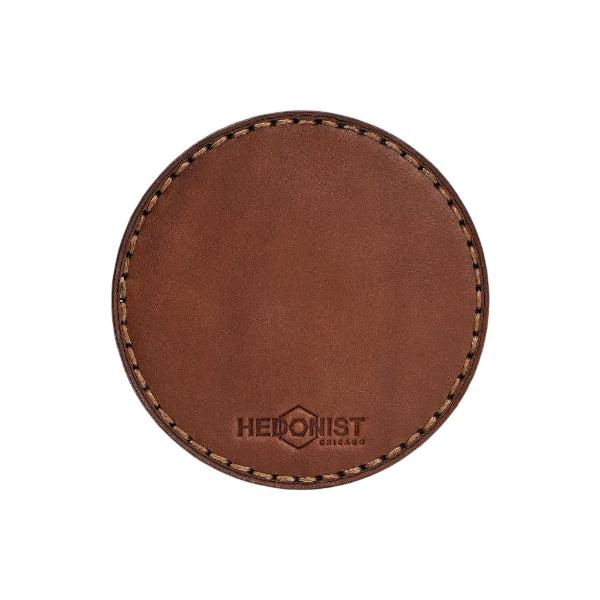 Hedonist Chicago leather coaster set in Whisky, clean edge, full grain leather, angled view
