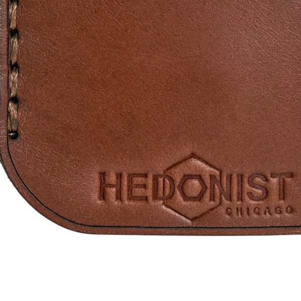 Hedonist Chicago whisky key chain in whisky, slim profile, full grain leather, flat lay view