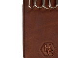 Hedonist Chicago whisky key holder in whisky, slim profile, full grain leather, flat lay view