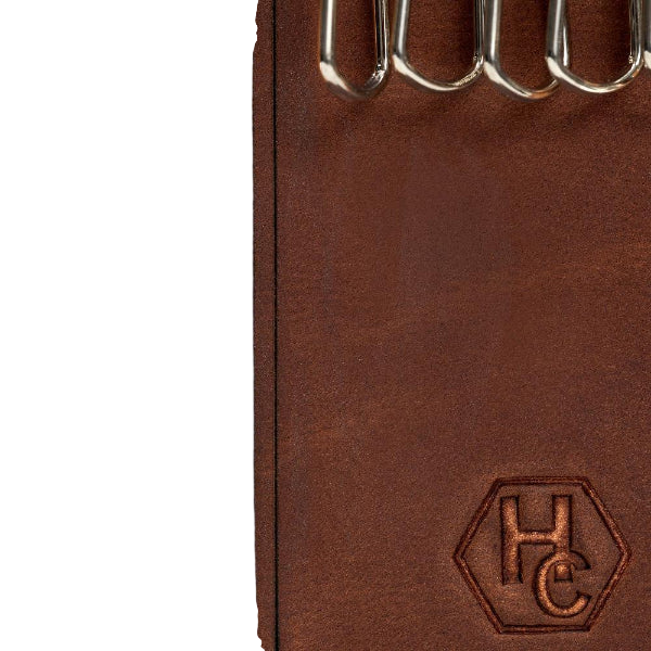 Hedonist Chicago whisky key holder in whisky, slim profile, full grain leather, flat lay view