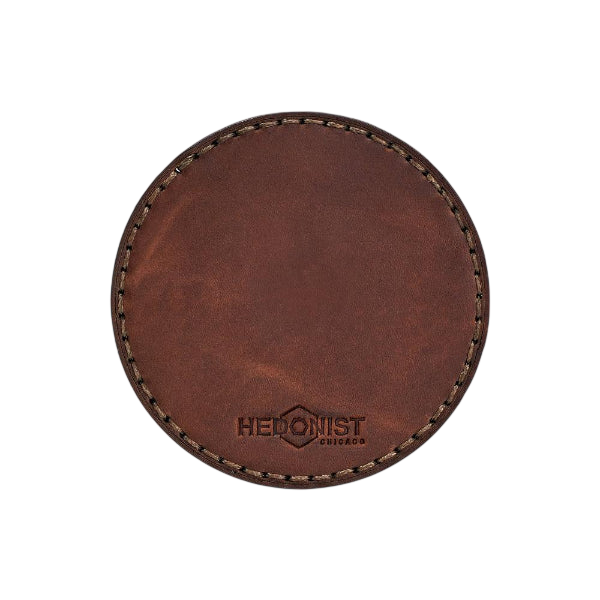 Hedonist Chicago leather coaster set in Whisky Pull-up finish, clean edge, full grain leather, angled view