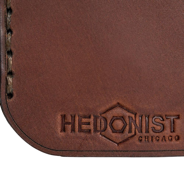 Hedonist Chicago whisky pull-up key chain in whisky, slim profile, full grain leather, flat lay view