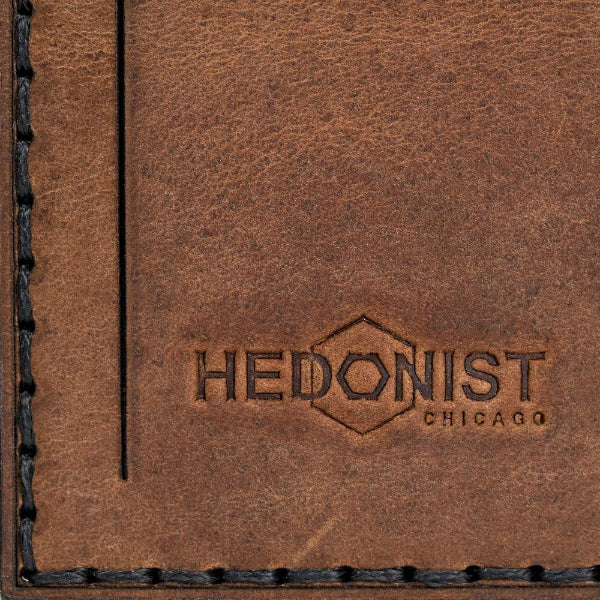 Hedonist Chicago whisky luggage tag in whisky, with strap, full grain leather, flat lay view