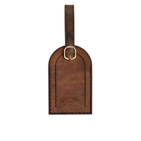 Hedonist Chicago whisky luggage tag in whisky, with strap, full grain leather, product view