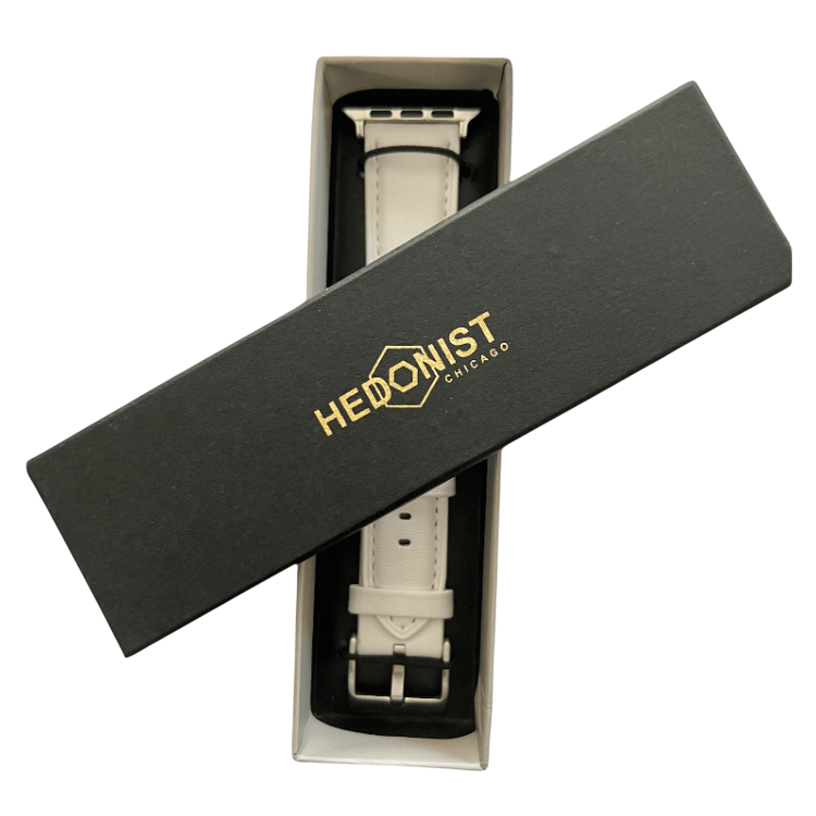 White padded leather Apple Watch band, presented in gift box