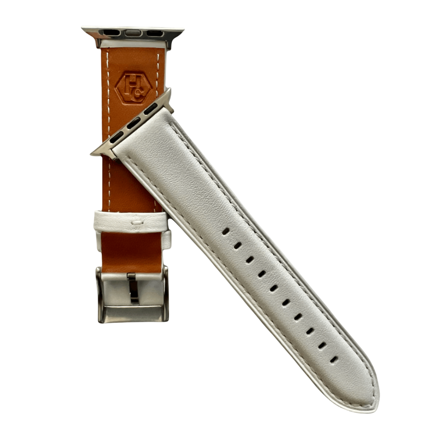 White padded leather Apple Watch band, texture and buckle detail close-up