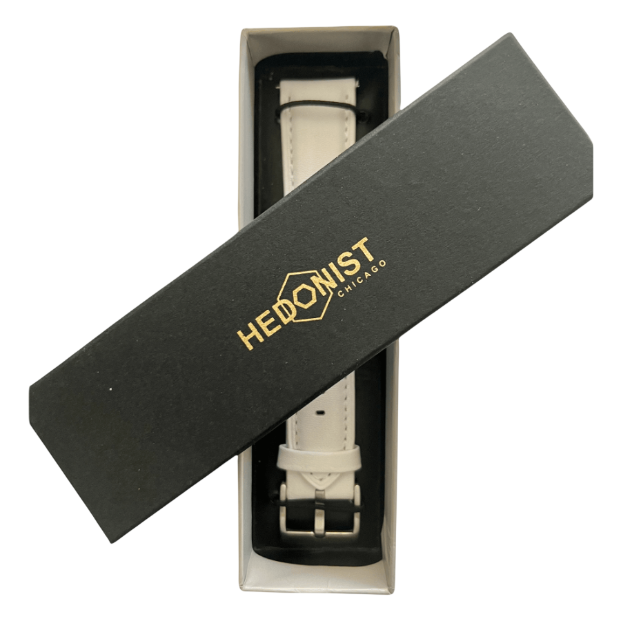 White leather watch band, close-up of logo on box