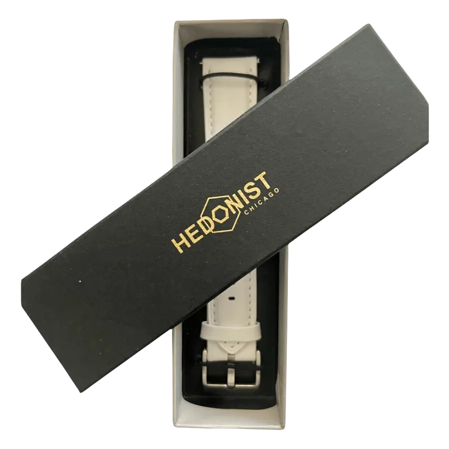 White leather watch band, close-up of logo on box