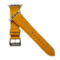 Yellow leather Apple Watch band, texture and buckle detail close-up