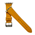Yellow leather Apple Watch band, texture and buckle detail close-up