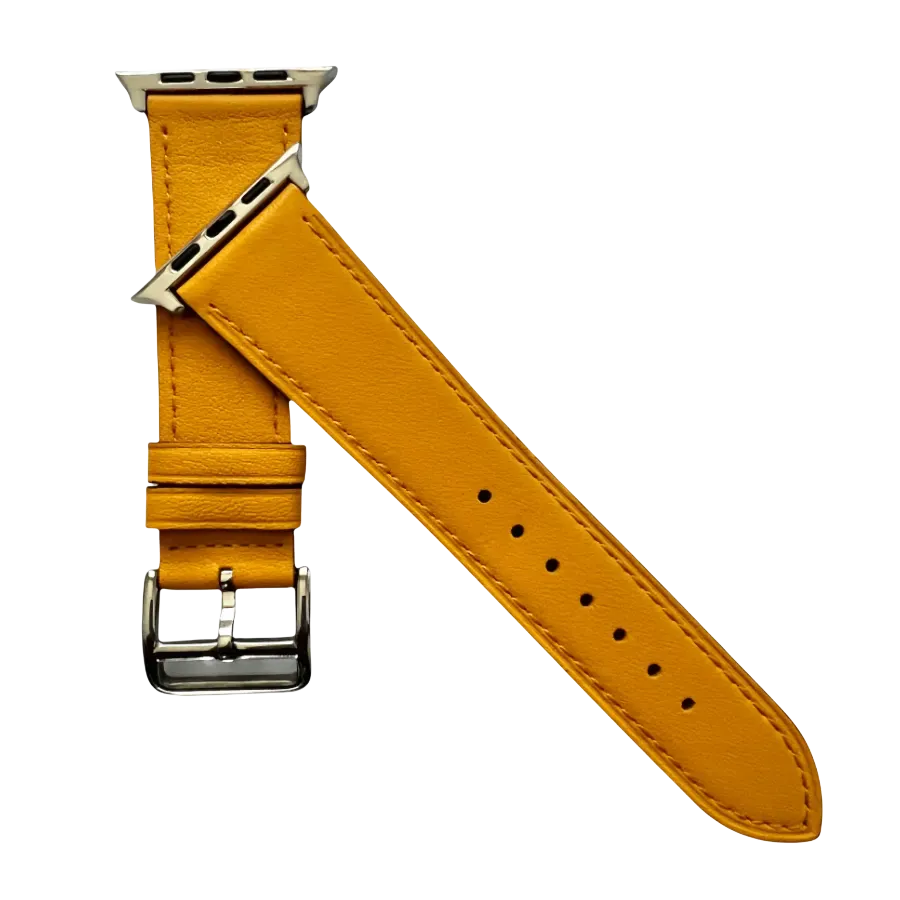 Yellow leather Apple Watch band, texture and buckle detail close-up